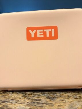 Yeti Pale Pink Cooler with Orange Logo